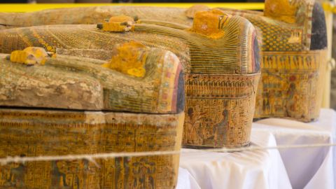 A photograph taken on October 19, 2019 shows sarchophagi displayed in front of Hatshepsut Temple in Egypt's valley of the Kings in Luxor - Egypt revealed today a rare trove of 30 ancient wooden coffins that have been well-preserved over millennia in the archaeologically rich Valley of the Kings in Luxor.
The antiquities ministry officially unveiled the discovery made at Asasif, a necropolis on the west bank of the Nile River, at a press conference against the backdrop of the Hatshepsut Temple. (Photo by Khaled DESOUKI / AFP) (Photo by KHALED DESOUKI/AFP via Getty Images)
