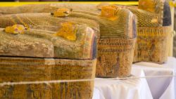 A photograph taken on October 19, 2019 shows sarchophagi displayed in front of Hatshepsut Temple in Egypt's valley of the Kings in Luxor - Egypt revealed today a rare trove of 30 ancient wooden coffins that have been well-preserved over millennia in the archaeologically rich Valley of the Kings in Luxor.
The antiquities ministry officially unveiled the discovery made at Asasif, a necropolis on the west bank of the Nile River, at a press conference against the backdrop of the Hatshepsut Temple. (Photo by Khaled DESOUKI / AFP) (Photo by KHALED DESOUKI/AFP via Getty Images)