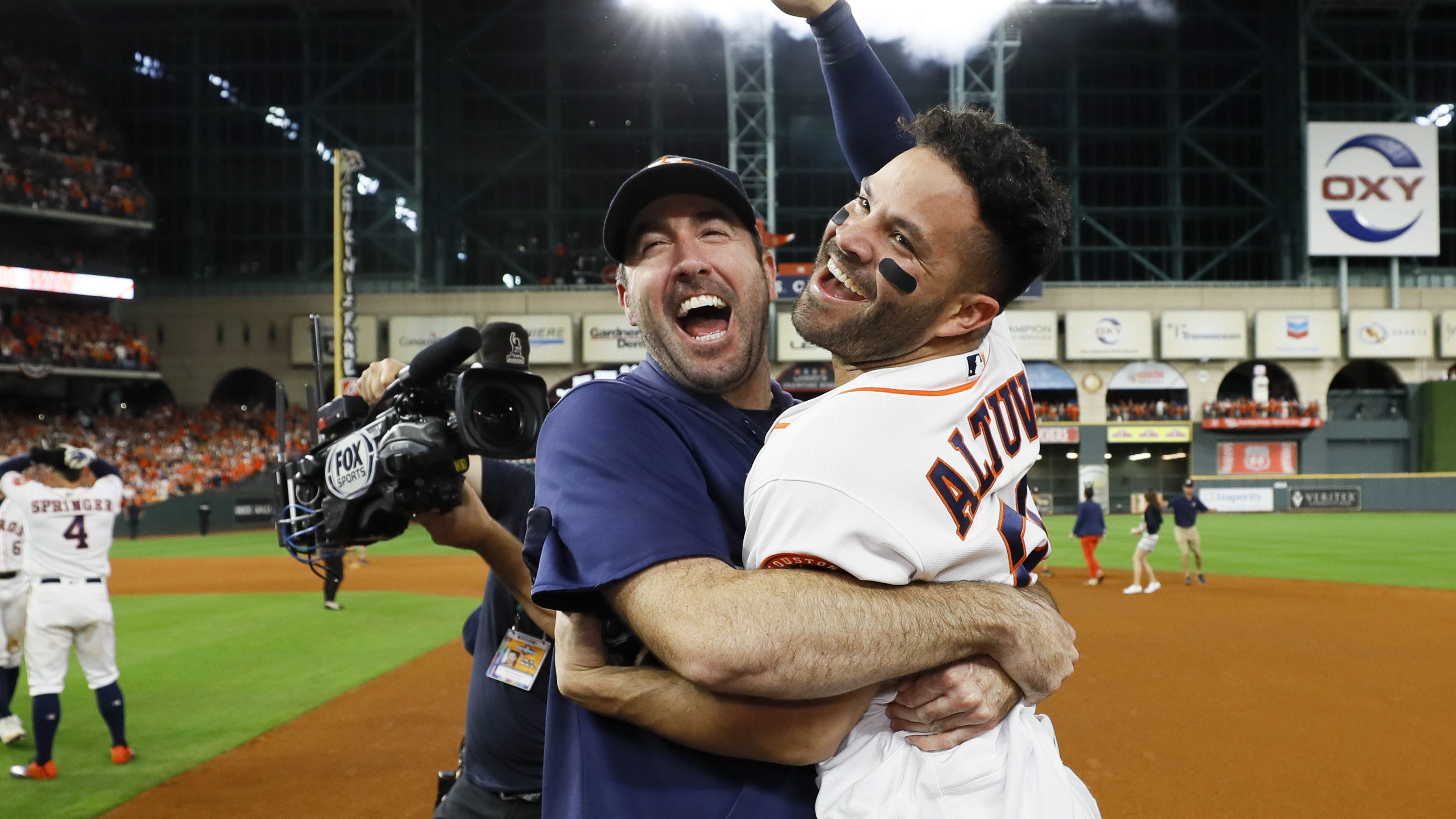 Houston Astros' Jose Altuve, right, and starting pitcher Justin Verlander celebrate after winning Game 6 of baseball's American League Championship Series against the New York Yankees. 