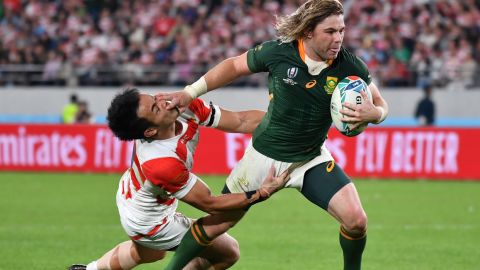 Player of the match Faf de Klerk powers towards the try line.