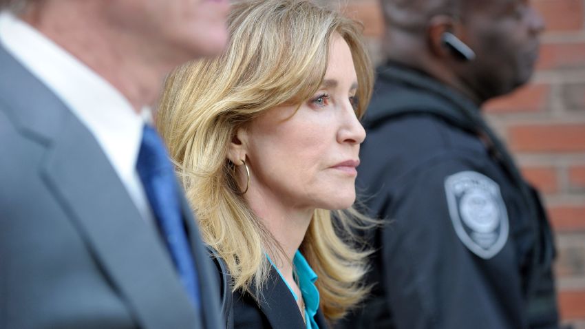 TOPSHOT - Actress Felicity Huffman exits the courthouse after facing charges for allegedly conspiring to commit mail fraud and other charges in the college admissions scandal at the John Joseph Moakley United States Courthouse in Boston on April 3, 2019. (Photo by Joseph Prezioso / AFP)        (Photo credit should read JOSEPH PREZIOSO/AFP/Getty Images)