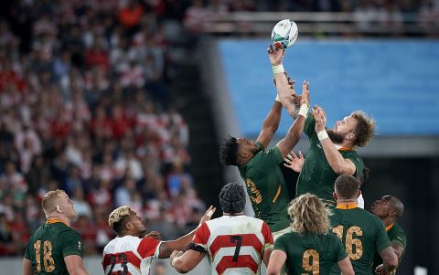 Lukhanyo Am (C) of South Africa jump for the balls during a lineout.