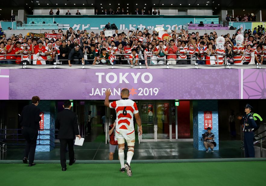 Michael Leitch of Japan acknowledges the crowd whilst walking down the tunnel after the Brave Blossoms' defeat.