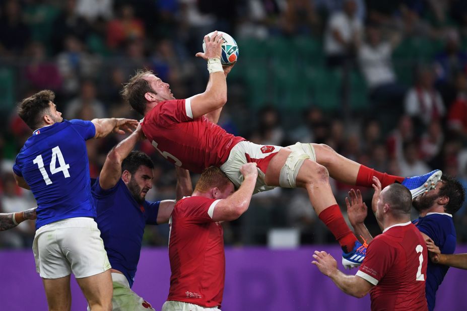 Wales' lock Alun Wyn Jones (C) catches the ball.