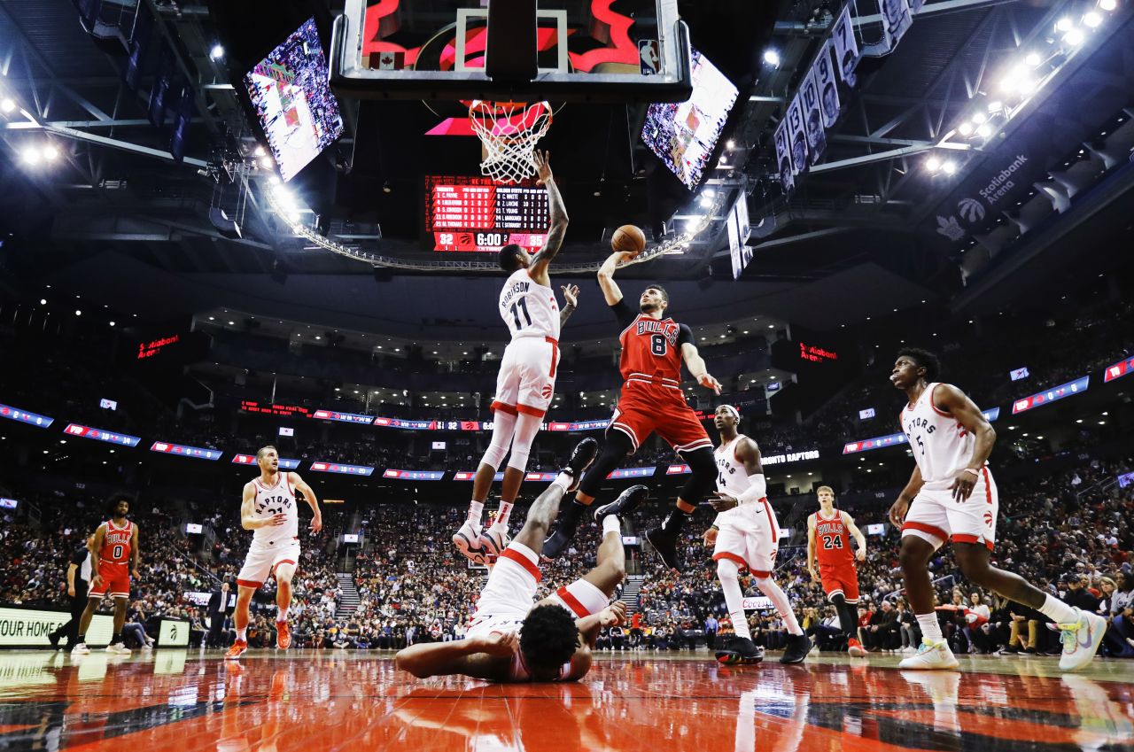 Devin Robinson of the Toronto Raptors attempts to block a shot by Chicago guard Zach LaVine during their NBA pre-season game at Scotiabank Arena in Toronto on Sunday, October 13.