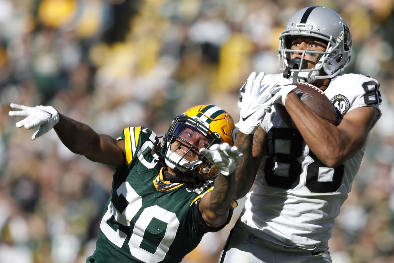 Oakland Raiders wide receiver Marcell Ateman catches a pass over Green Bay Packers cornerback Kevin King during the second half of an NFL football game in Green Bay, Wisconsin, on Sunday, October 20.
