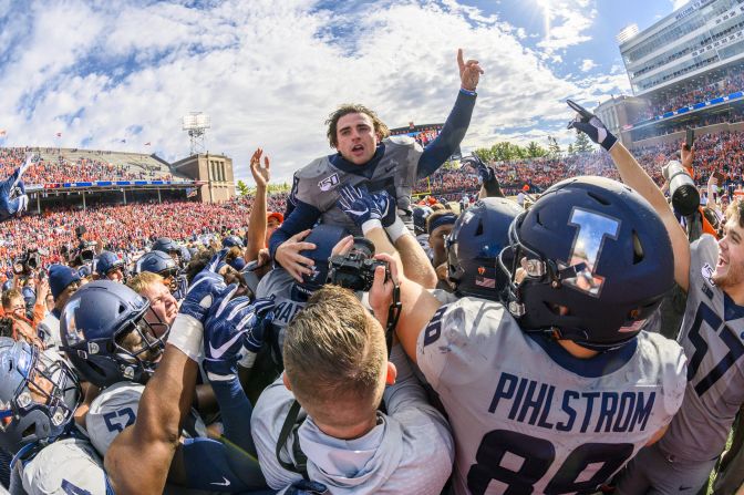 Illinois kicker James McCourt is hoisted in the air by his teammates after kicking the game winning field goal against the Wisconsin Badgers in a college football game at Memorial Stadium in Champaign, Illinois, on October 19.