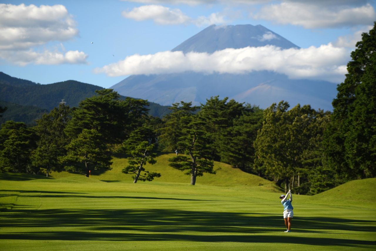 Mt. Fuji is seen in the background as Saki Takeo of Japan plays during the final round of the Stanley Ladies at Tomei Country Club in Susono, Japan, on October 13.