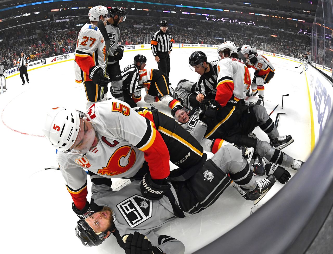 Players from the Calgary Flames and Los Angeles Kings brawl during the third period of their game at Staples Center in Los Angeles, California, on October 19.