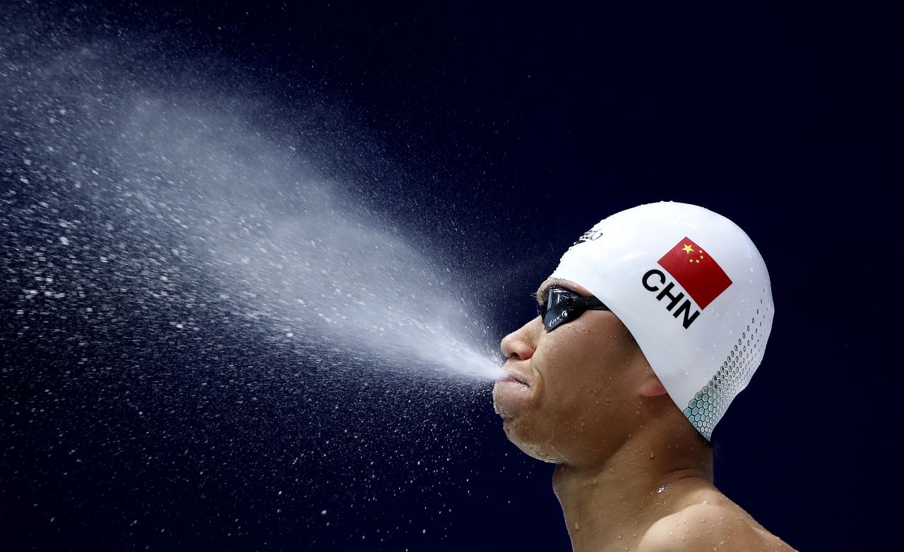 Chinese swimmer Ruixuan Zhang blows water out of his mouth before the 200-meter breaststroke final during the FINA Swimming World Cup in Berlin, Germany, on October 13.