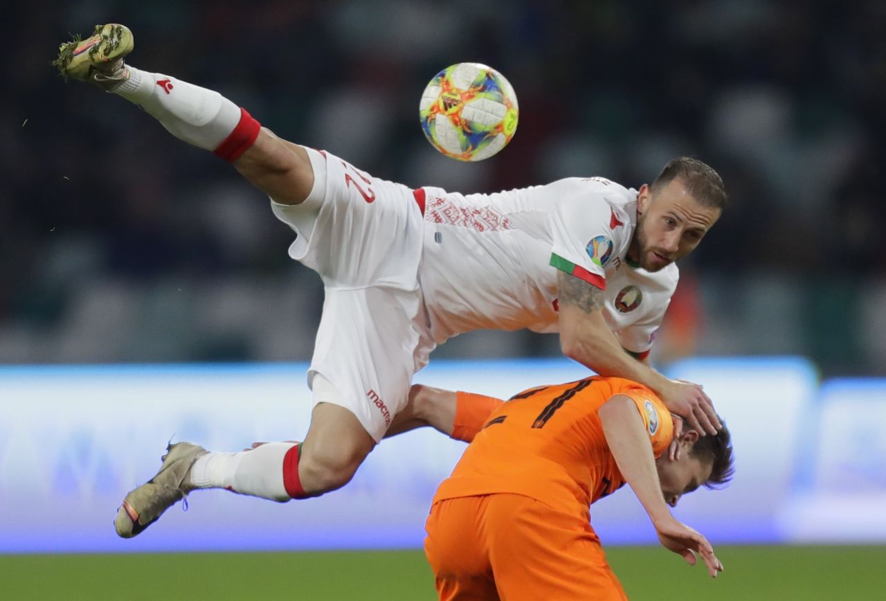 Belarus' Igor Stasevich jumps over Netherlands' Frenkie de Jong for the ball during a Euro 2020 qualifying soccer match at the Dinamo Stadium in Minsk, Belarus, on October 13. 