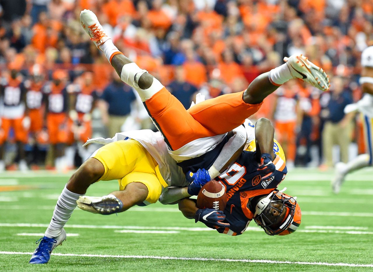 Pittsburgh Panthers defensive back Damar Hamlin tackles Syracuse Orange wide receiver Nykeim Johnson during the second quarter at the Carrier Dome in Syracuse, New York, on Friday, October 18. 