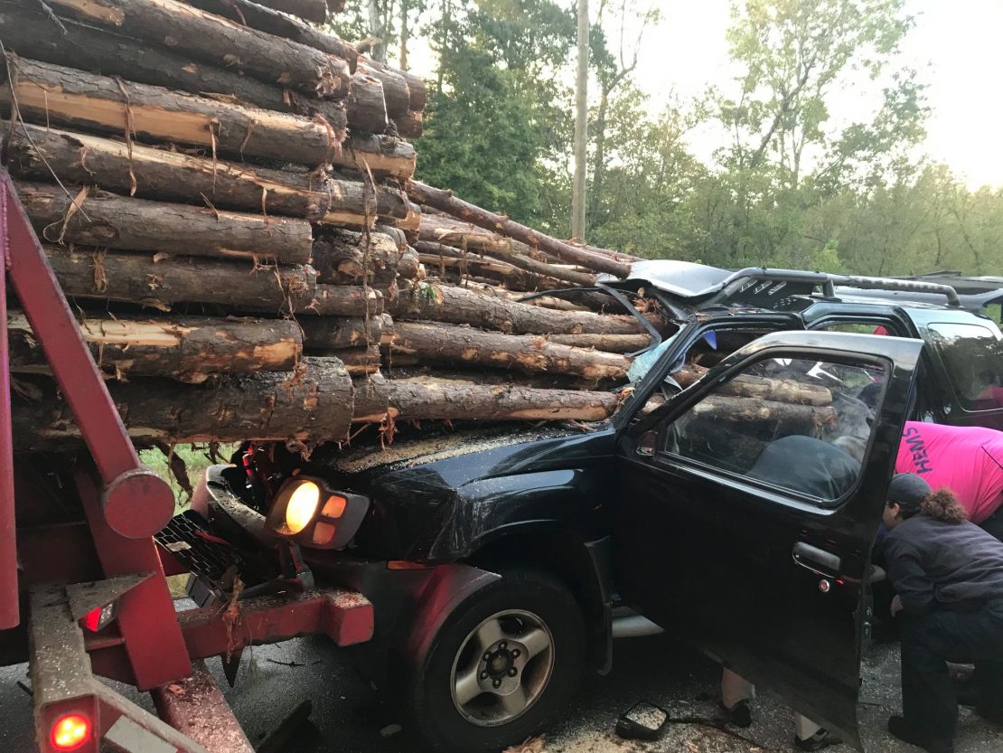 01 car impaled by log truck