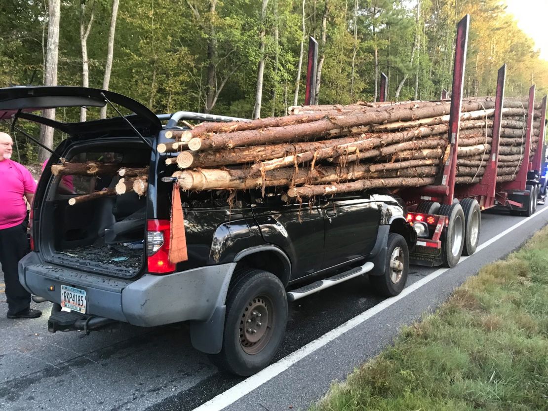 03 car impaled by log truck