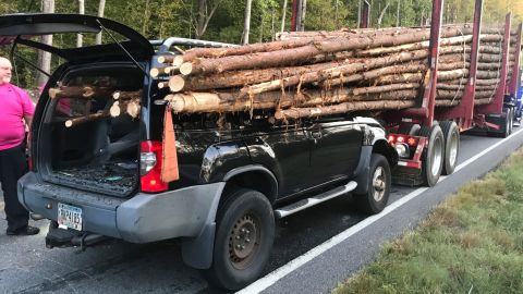 03 car impaled by log truck