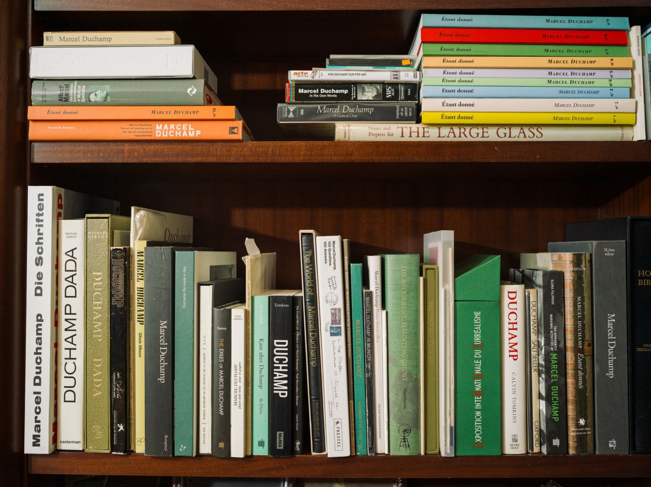 Bookshelf full of Marcel Duchamp's art books.