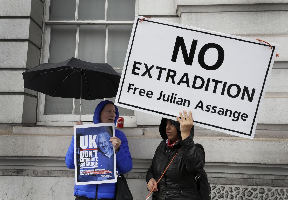 Supporters of Wikileaks founder Julian Assange demonstrate oustside Westminster Magistrates' Court in London.