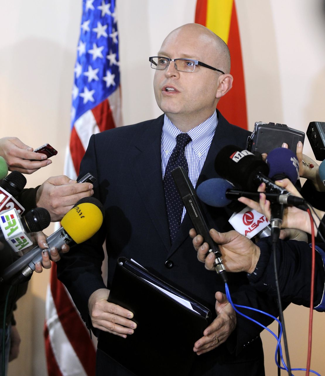 US Deputy Assistant Secretary for European and Eurasian Affairs Philip Reeker, center, talks to media in January 2012. 