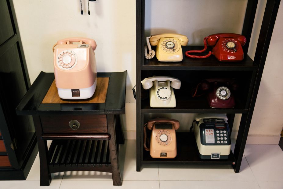 Old phones on display in Harry Ang's living room. 