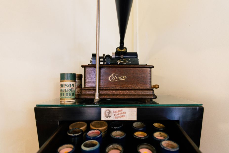 Harry Ang's collection of cylinder records in a drawer under an Edison phonograph. 