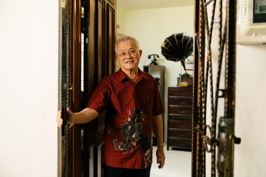 Ang poses for a photograph in his home.