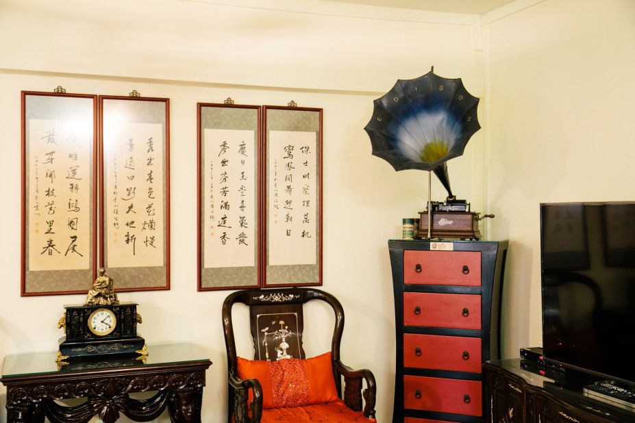 A phonograph displayed in the living room of Ang's home. 