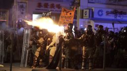 Police fire tear gas to disperse protestors in Hong Kong, Sunday, Oct. 20, 2019. Hong Kong protesters again flooded streets on Sunday, ignoring a police ban on the rally and setting up barricades amid tear gas and firebombs. (AP Photo/Mark Schiefelbein)