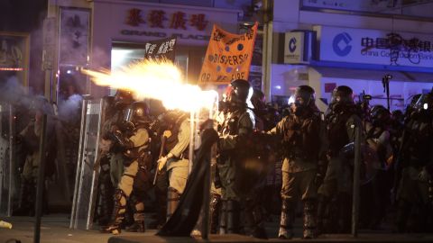 Police fire tear gas to disperse protestors in Hong Kong on Sunday.