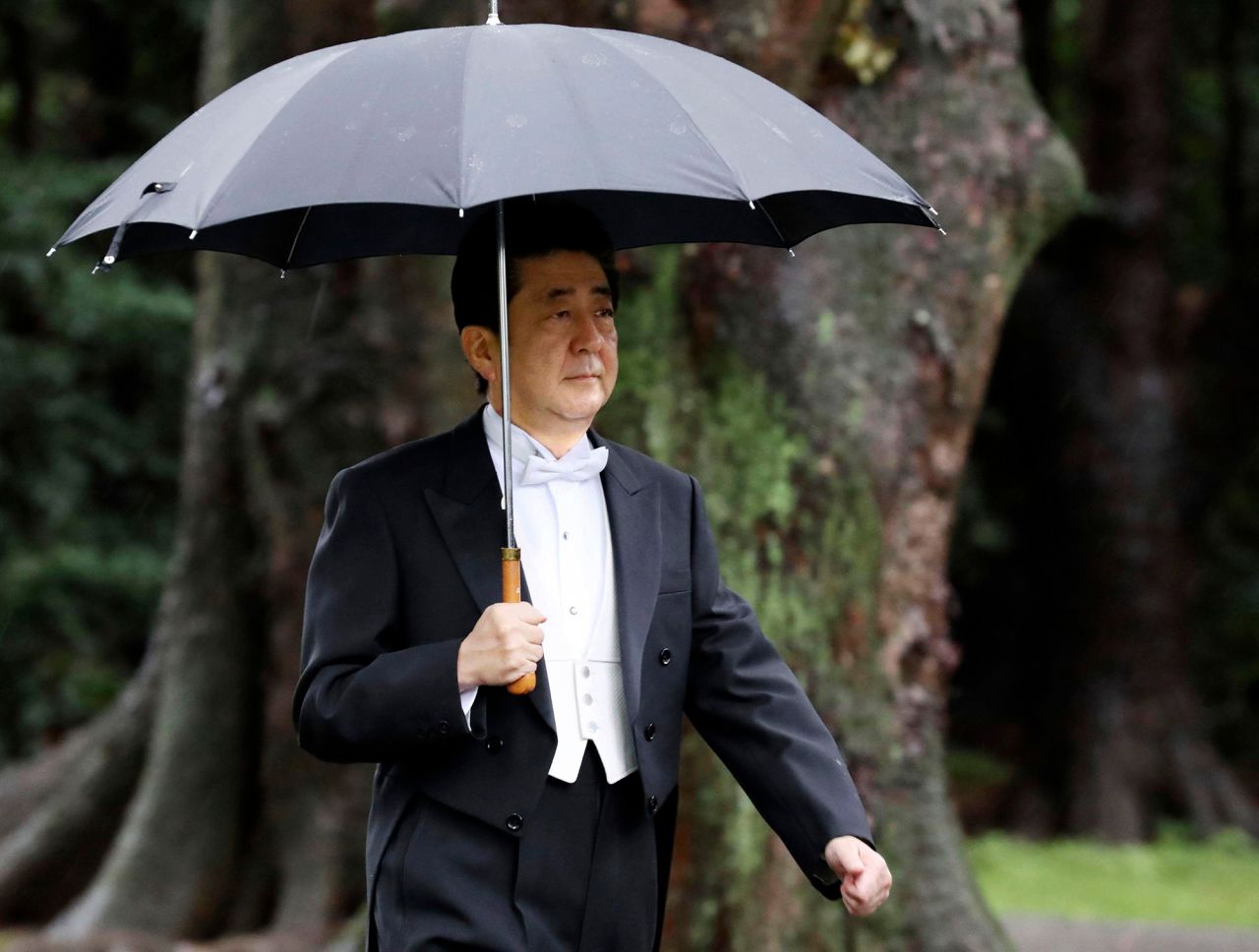Japan's Prime Minister Shinzo Abe arrives for the ceremony at Kashikodokoro.