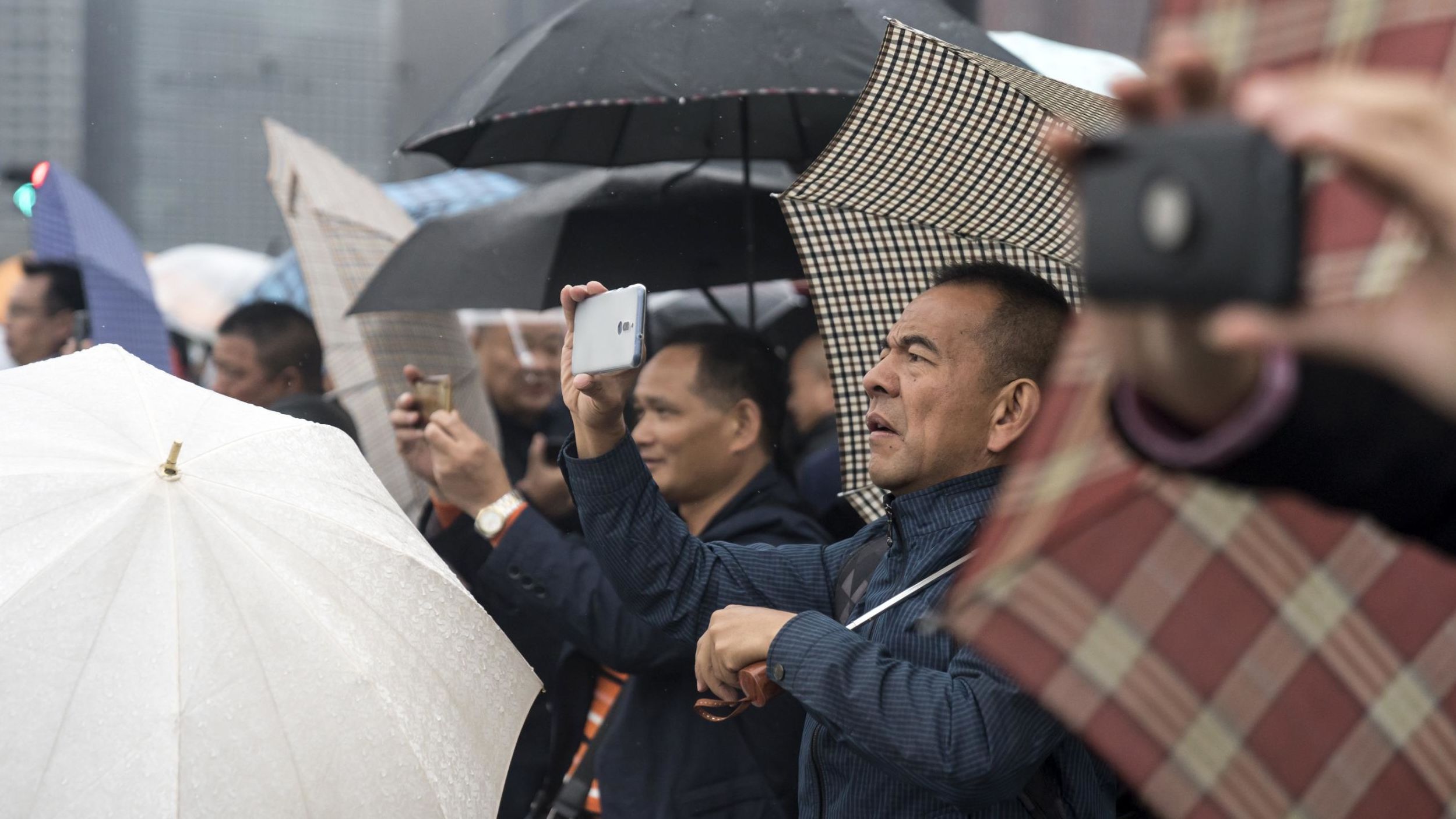 People photograph the Imperial Palace before Japan's Emperor Naruhito's proclamation of his ascension to the throne.