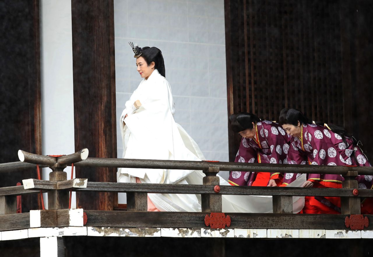 Japan's Empress Masako walks to Kashikodokoro sanctuary for a ritual at the Imperial Palace.