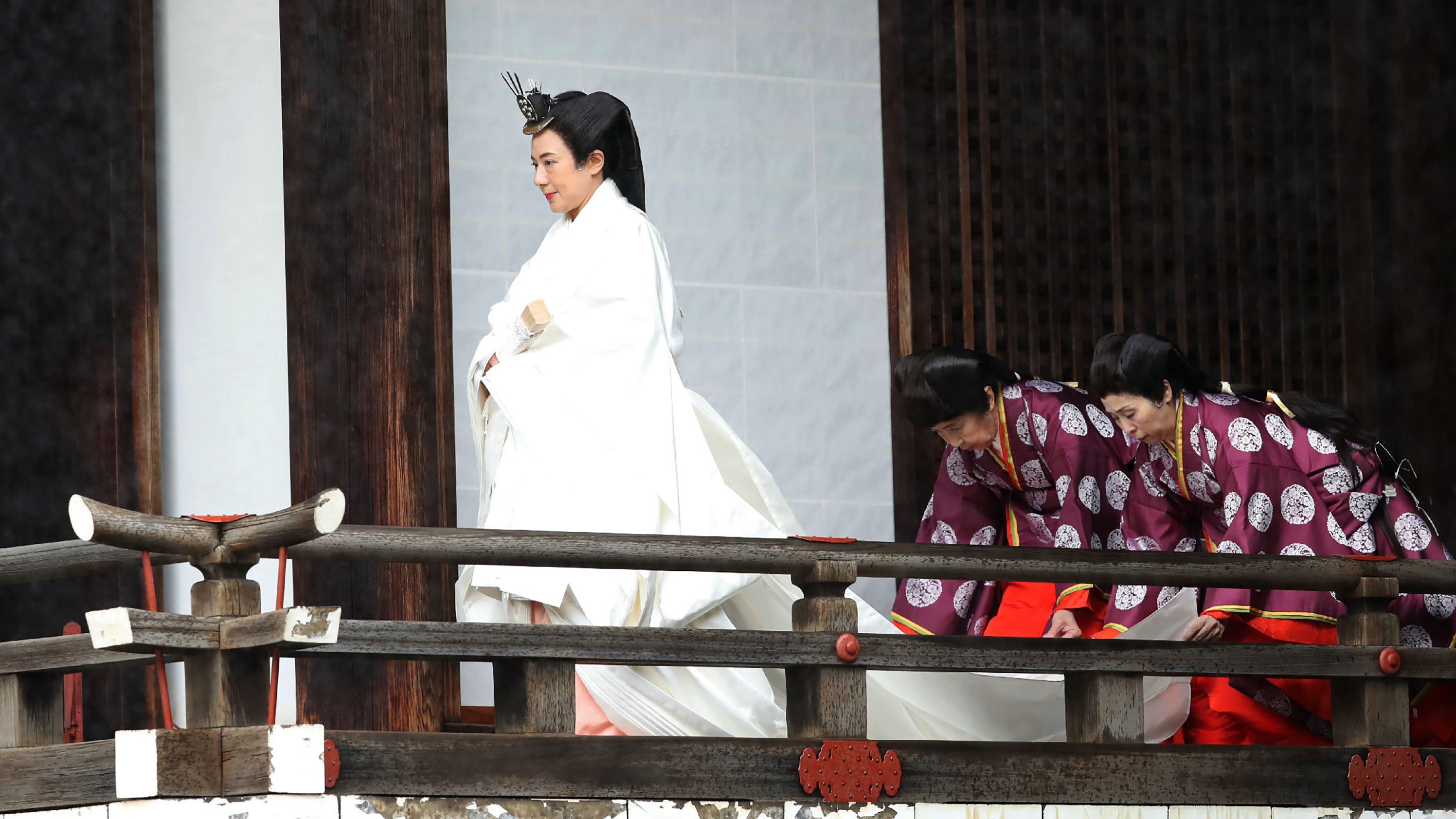 Japan's Empress Masako walks to Kashikodokoro sanctuary for a ritual at the Imperial Palace.