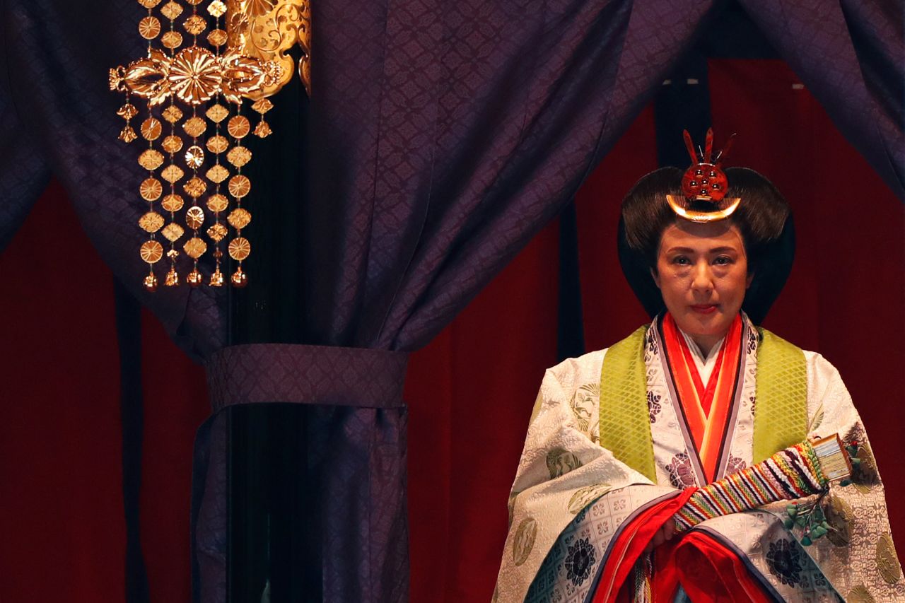 Japan's Empress Masako makes her appearance during a ceremony to proclaim Emperor Naruhito's enthronement. 