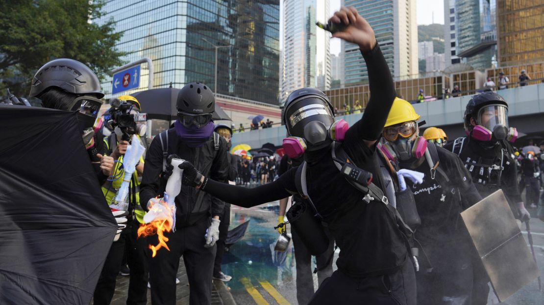An anti-government protester throws a Molotov cocktail during a demonstration near Central Government Complex in Hong Kong, in September. 