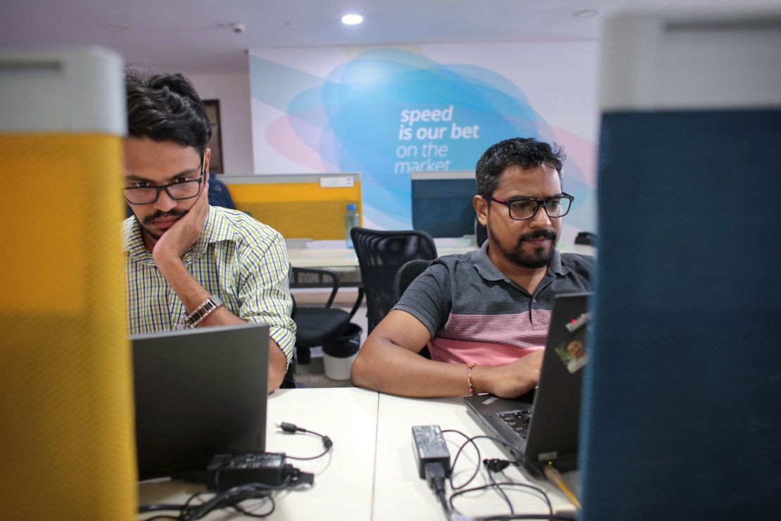 Employees at Paytm's headquarters, which is decorated with phrases like "Go big or go home" and "speed is our bet." (Saurabh Das for CNN)