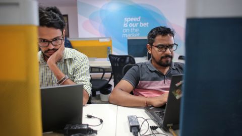Employees at Paytm's headquarters, which is decorated with phrases like "Go big or go home" and "speed is our bet." (Saurabh Das for CNN)
