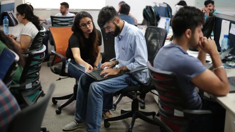 Employees work at Patym's headquarters. (Saurabh Das for CNN)