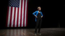 Senator Elizabeth Warren, a Democrat from Massachusetts and 2020 presidential candidate, stands on stage during a campaign event at Iowa State University in Ames, Iowa, U.S., on Monday, Oct. 21, 2019. Warren unveiled an $800 billion plan to fund her progressive proposal for reshaping U.S. public education and disclosed that her signature wealth tax will pay for school and child-care initiatives -- in effect transferring the cost of raising a child from birth to college to America's richest families. Photographer: Daniel Acker/Bloomberg/Getty Images