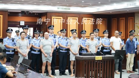 The six men were charged with intentional homicide after staging and outsourcing a murder plot in China's southern Guangxi province.