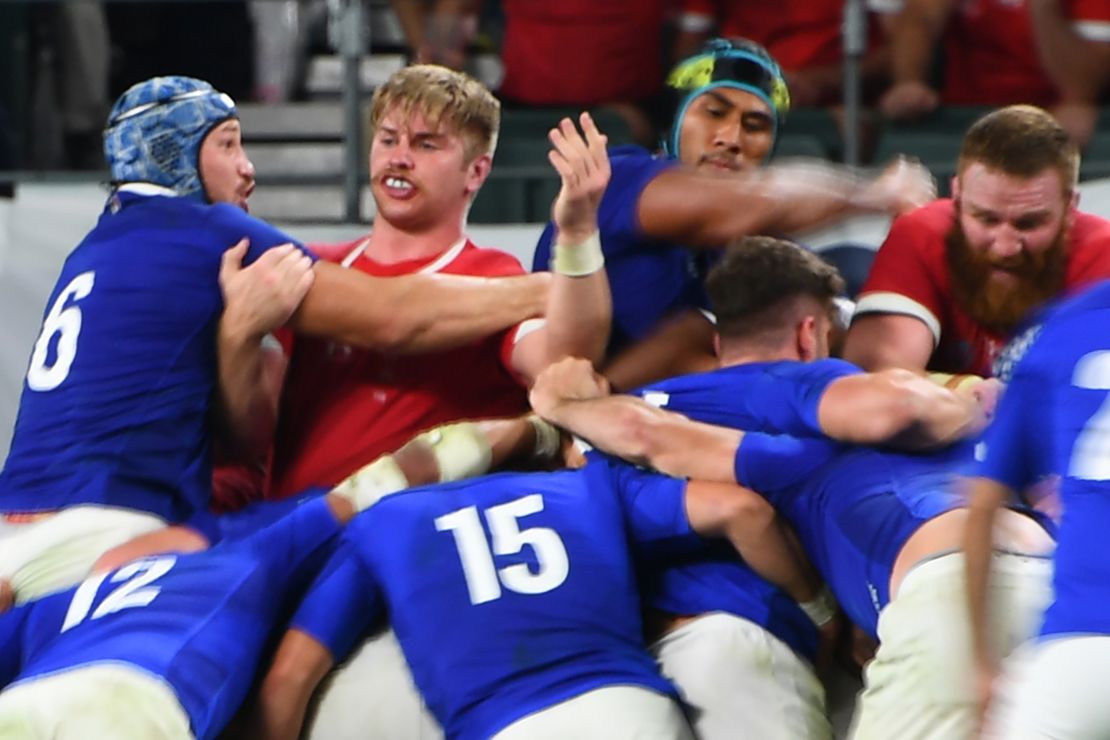France's lock Sebastien Vahaamahina (black cap) moments before he elbows Wales' flanker Aaron Wainwright (2nd left) in the Rugby World Cup quarterfinal. 