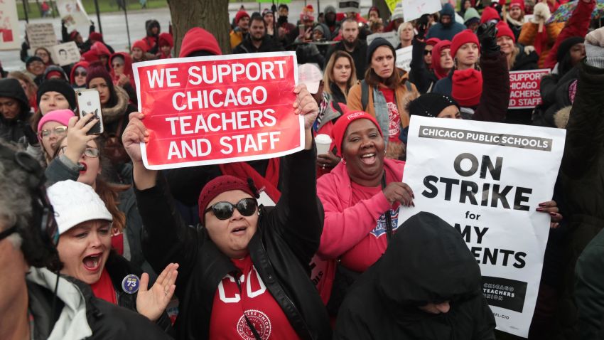 Striking Chicago teachers and their supporters rally outside of Oscar DePriest Elementary School on October 22, 2019 in Chicago, Illinois.