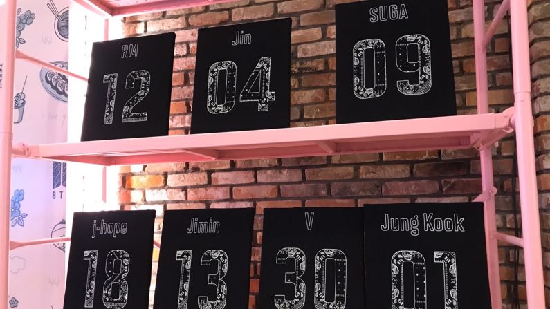 <strong>Catch 'em all: </strong>T-shirts with the names and birth dates of the BTS members are on display too.