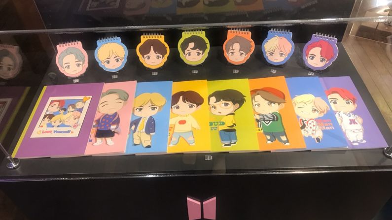 <strong>Drawn together:</strong> Memo pads and notebooks feature new cartoon versions of the BTS members that were introduced on opening day.