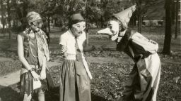 Three girls amuse each other with their masked costumes as they prepare for Halloween festivities in the College Hill neighborhood of Cincinnati, Ohio, 1929. (Photo by Felix Koch/Cincinnati Museum Center/Getty Images)