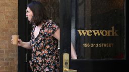 A woman walks out of a WeWork office on October 07, 2019 in San Francisco, California. Days after withdrawing its registration for an initial public offering.