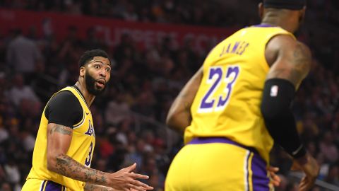 Newly aquired Anthony Davis (left) of the Los Angeles Lakers interacted with teammate LeBron James during the first half of the game.