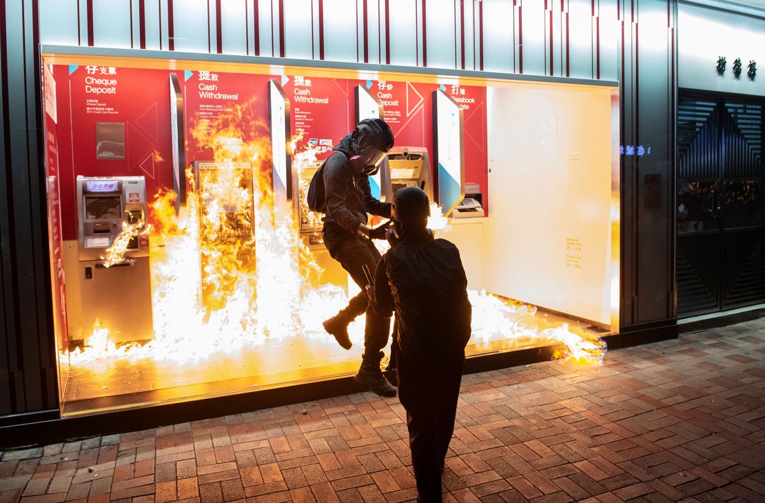 Protesters set a Bank of China branch on fire in Hong Kong on October 13, 2019.