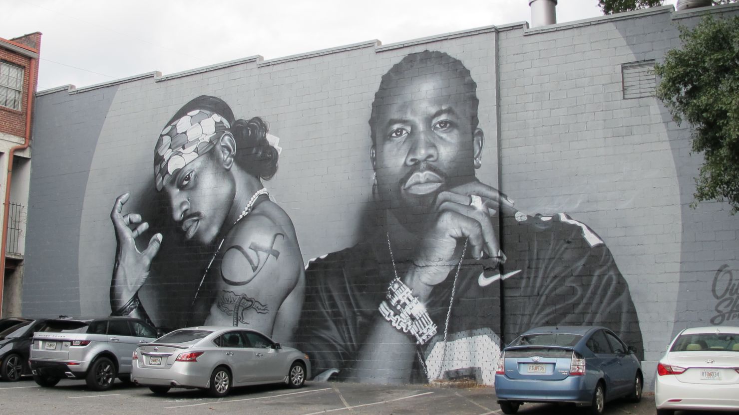 A mural of OutKast in Atlanta's Little Five Points neighborhood has attracted crowds of people coming to see the iconic duo. 