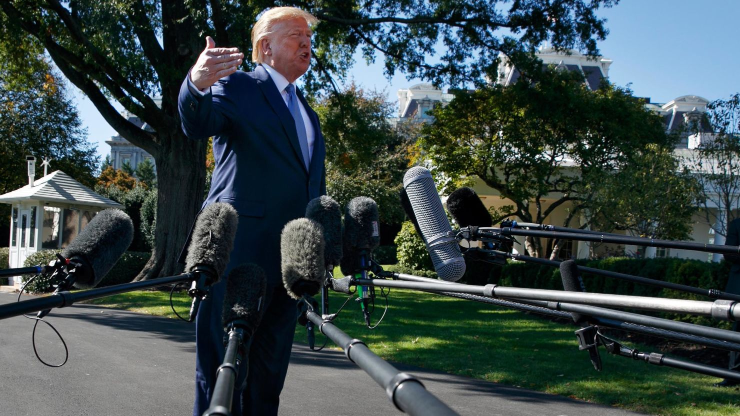 President Donald Trump speaks to members of the media as he leaves the White House, Wednesday, October 23.