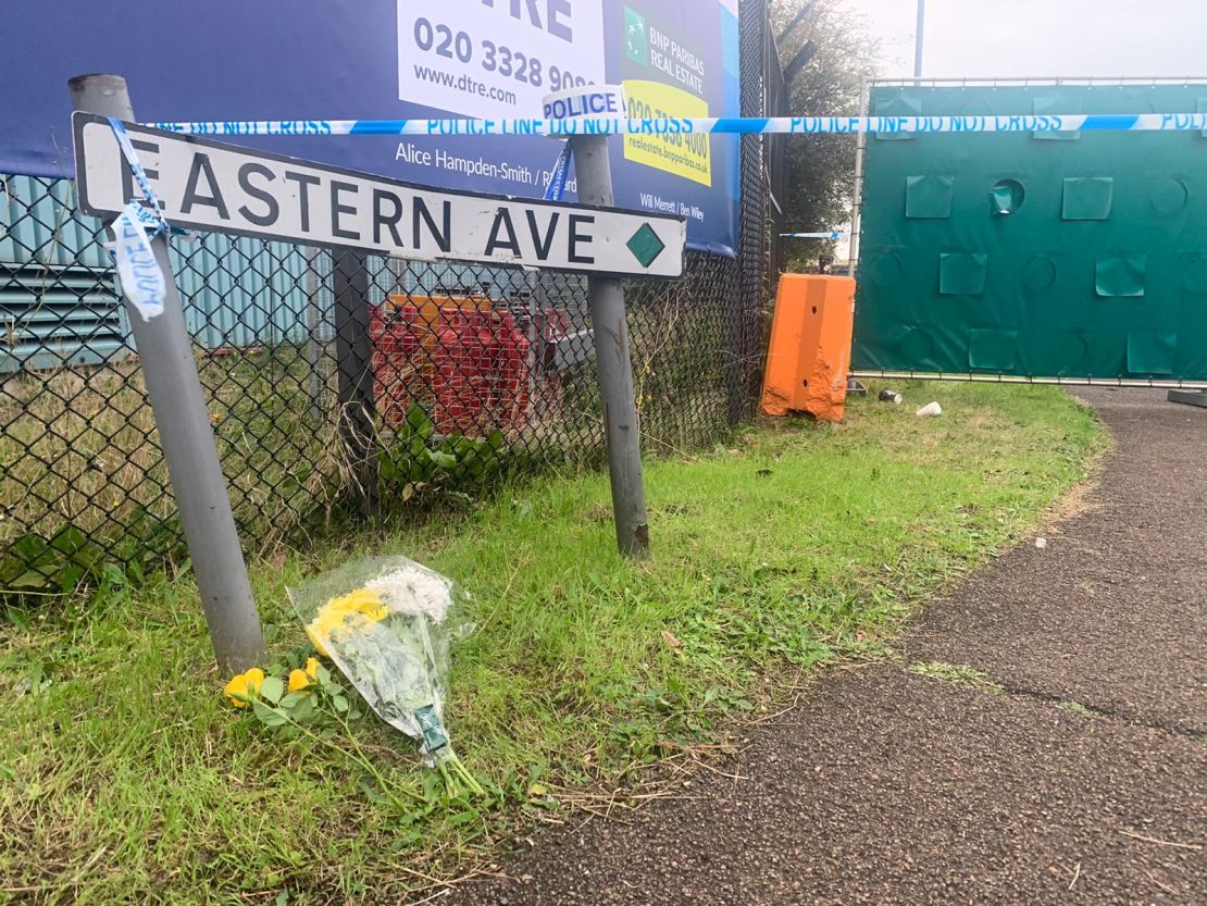 Flowers were laid at the entrance to the industrial park in Grays, Essex, where 39 bodies were found inside a truck container.